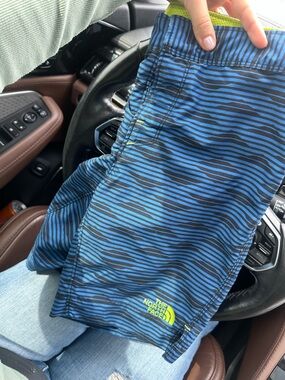 The North Face Blue and Black Striped Kids Swim Trunks with Lime Logo